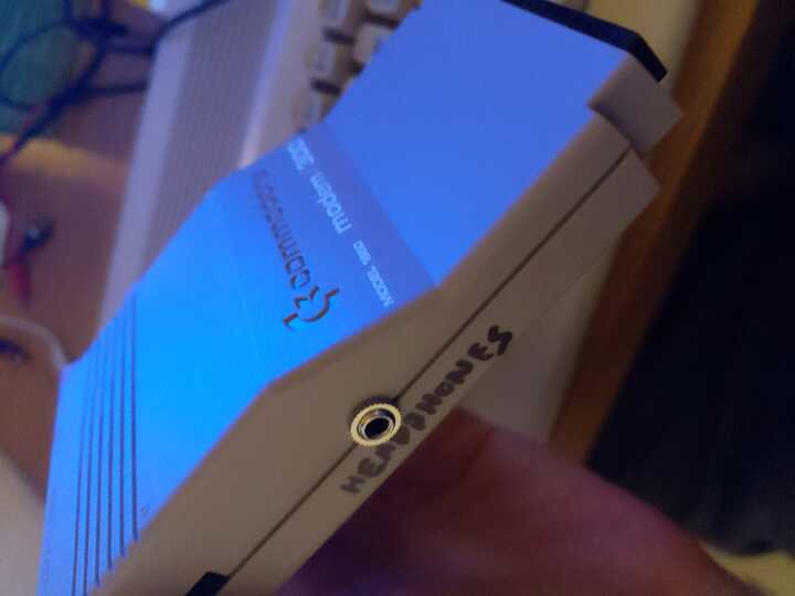 Commodore Modem 300 side view showing custom headphone jack