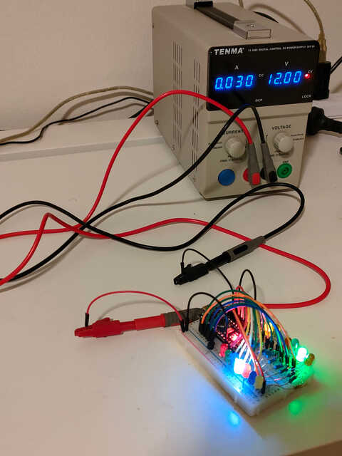 breadboard with arduino and LED chaser powered by a 12v power supply through the 78l05 voltage regulator